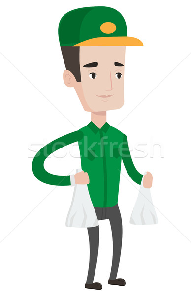 Stock photo: Delivery man delivering groceries to customer.