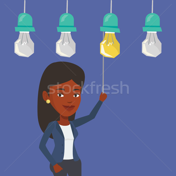 Nő üzlet ötlet üzletasszony akasztás villanykörte Stock fotó © RAStudio