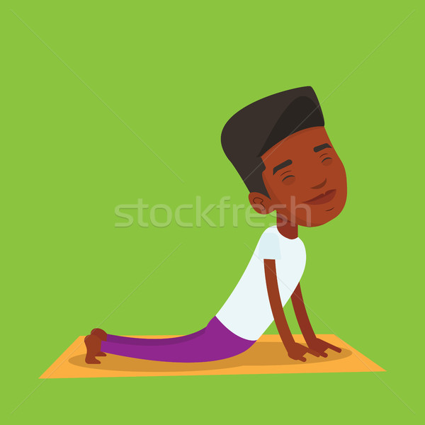 Stock photo: Man practicing yoga upward dog pose.