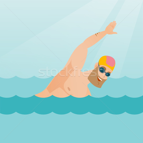 Young caucasian sportsman swimming. Stock photo © RAStudio