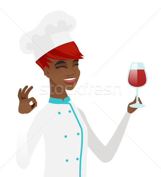 Chef holding glass of wine and showing ok sign. Stock photo © RAStudio