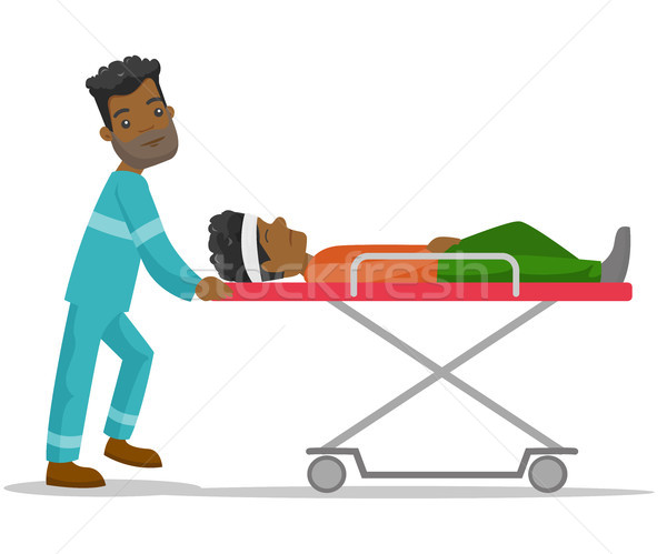 Emergency doctor transporting man on stretcher. Stock photo © RAStudio