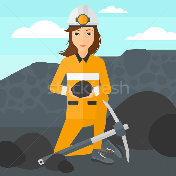 Miner holding coal in hands. Stock photo © RAStudio