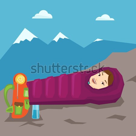 Woman sleeping in sleeping bag in the mountains. Stock photo © RAStudio