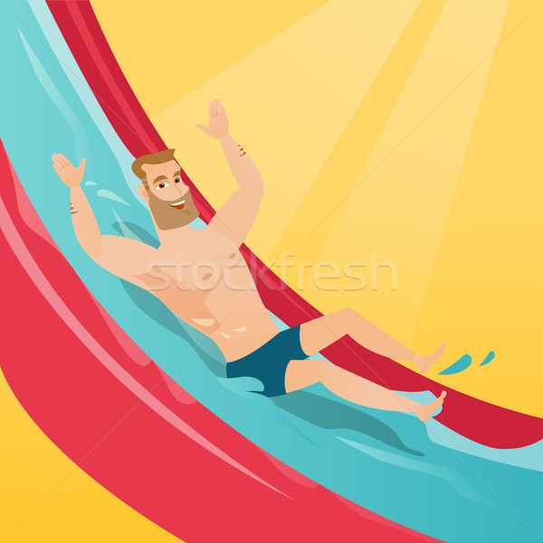 Young caucasian man riding down a waterslide. Stock photo © RAStudio
