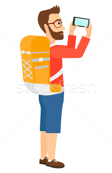 Backpacker taking photo. Stock photo © RAStudio