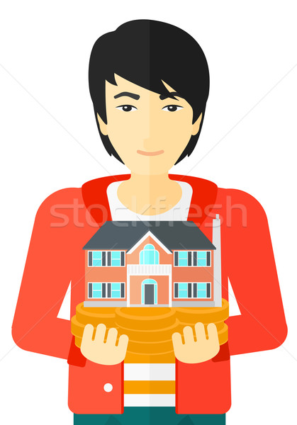 Man holding house model. Stock photo © RAStudio