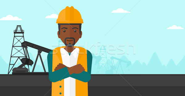 Stock photo: Cnfident oil worker.