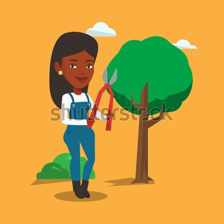 Farmer with pruner in garden vector illustration. Stock photo © RAStudio