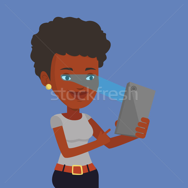 Stock photo: Woman using iris scanner to unlock mobile phone.