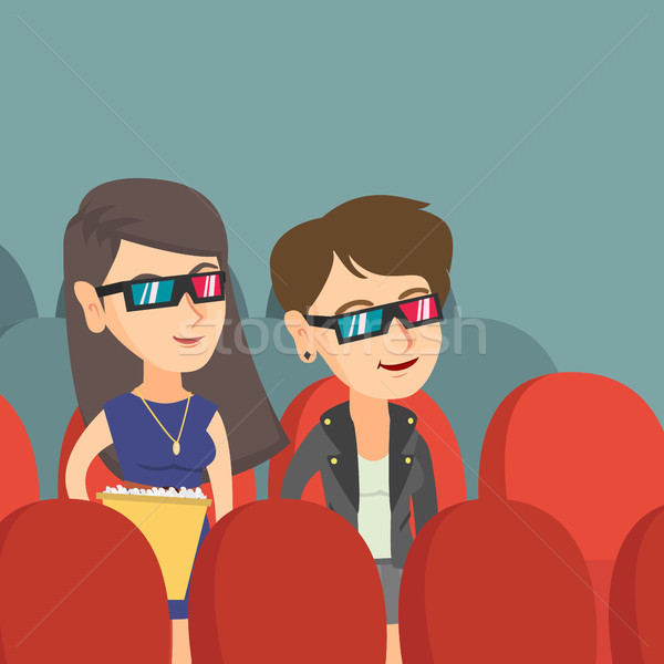 Caucasian women watching 3D movie in the theatre. Stock photo © RAStudio
