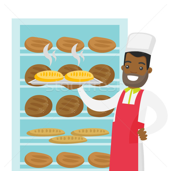 African-american baker holding tray with bread. Stock photo © RAStudio