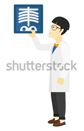 Doctor holding radiograph. Stock photo © RAStudio