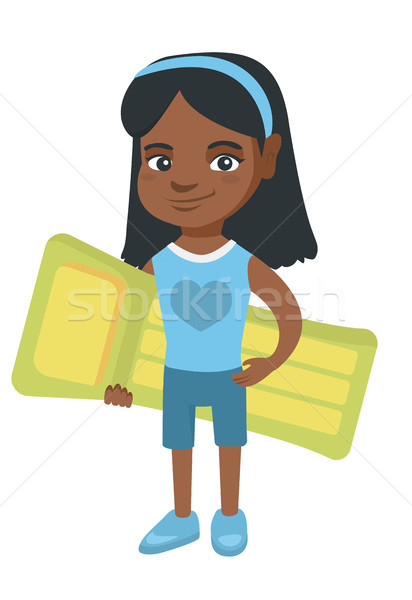 Little african girl holding inflatable mattress. Stock photo © RAStudio