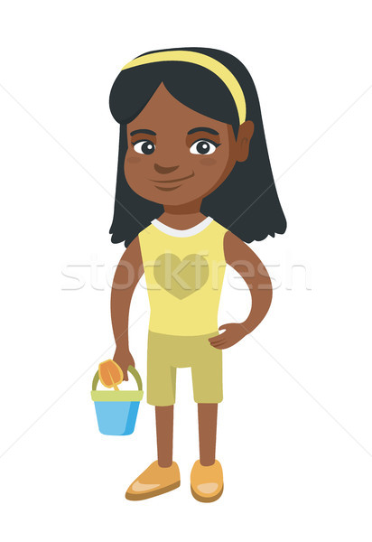 African girl in shorts holding pail and shovel. Stock photo © RAStudio