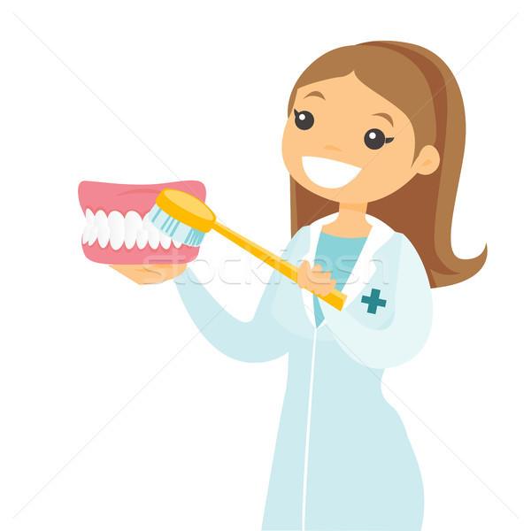 Zahnarzt halten Zahnpasta Zahnbürste weiß Stock foto © RAStudio