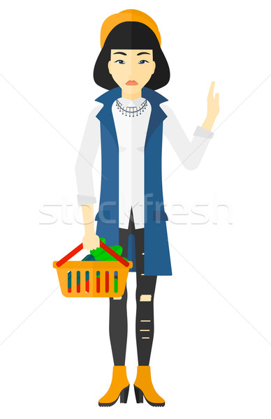 Woman holding supermarket basket. Stock photo © RAStudio