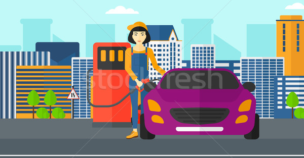 Woman filling up fuel into car. Stock photo © RAStudio