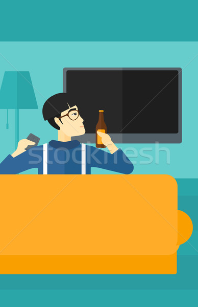 Hombre viendo tv Asia sesión sofá Foto stock © RAStudio
