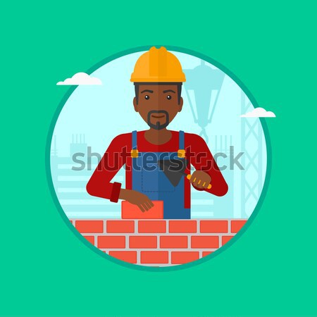 Male worker of solar power plant and wind farm. Stock photo © RAStudio