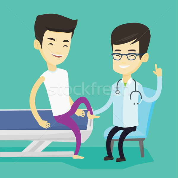 Gym doctor checking ankle of a patient. Stock photo © RAStudio