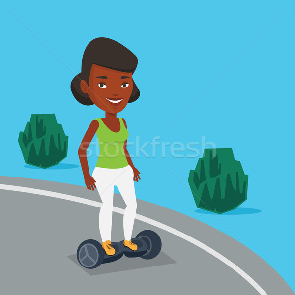 Woman riding on self-balancing electric scooter. Stock photo © RAStudio