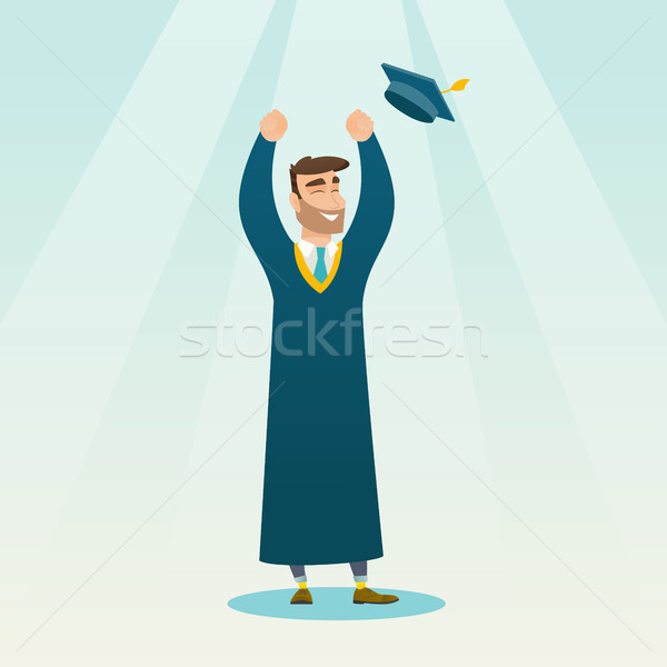 Graduate throwing up graduation hat. Stock photo © RAStudio