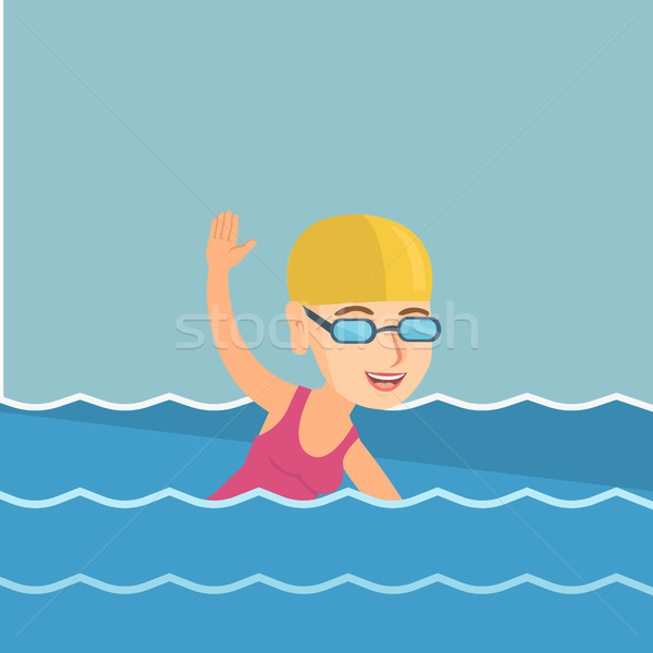 Stock photo: Young caucasian sportswoman swimming.