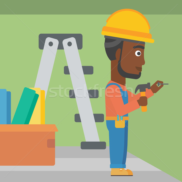 Constructor hammering nail. Stock photo © RAStudio