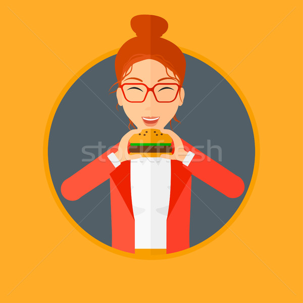 Donna mangiare hamburger felice Foto d'archivio © RAStudio