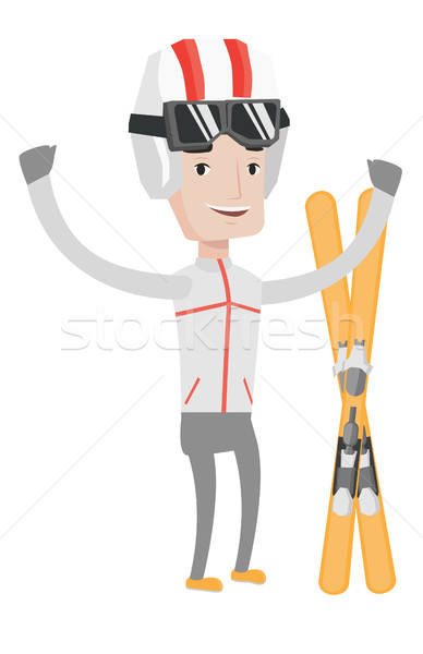 Cheerful skier standing with raised hands. Stock photo © RAStudio