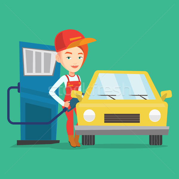 Stock photo: Worker filling up fuel into car.