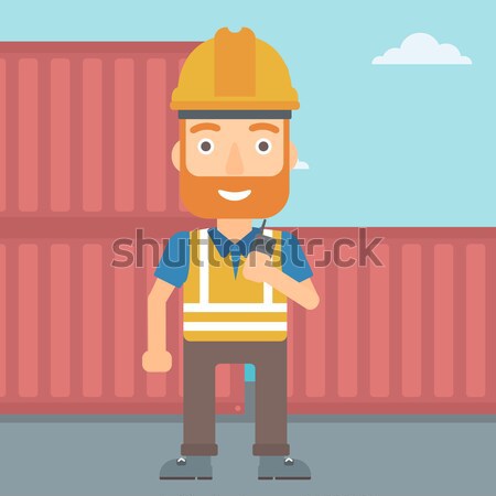 Port worker talking on wireless radio. Stock photo © RAStudio