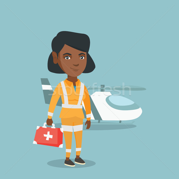Young african-american doctor of air ambulance. Stock photo © RAStudio