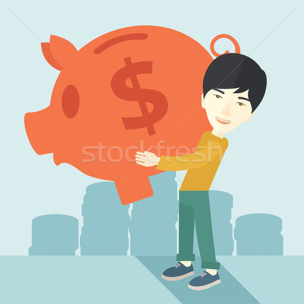 Chinese businessman carries a big piggy bank for saving money. Stock photo © RAStudio