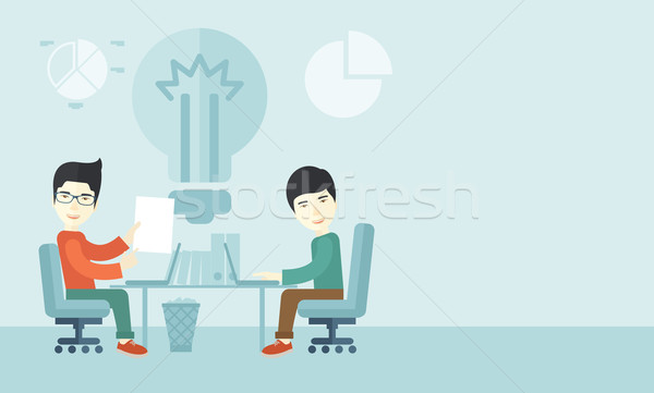Two japanese businessmen sitting working together. Stock photo © RAStudio
