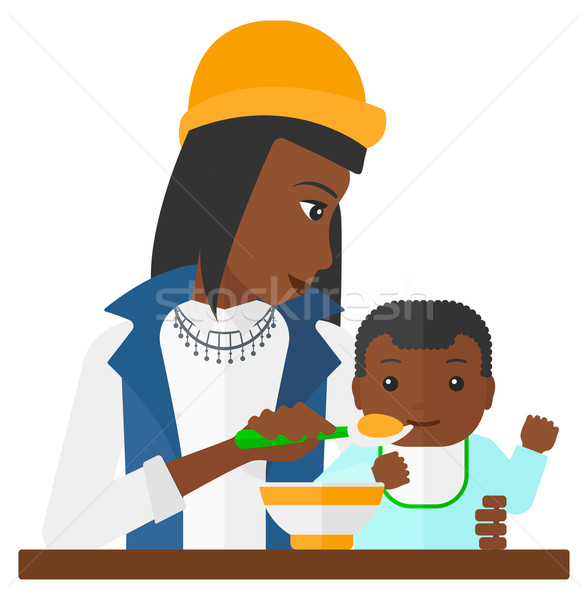 Woman feeding baby. Stock photo © RAStudio