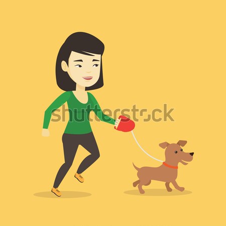 Young woman walking with her dog. Stock photo © RAStudio