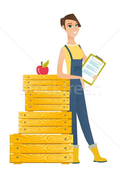 Farmer holding clipboard with documents. Stock photo © RAStudio