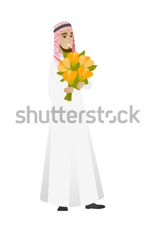 Hindu businessman holding bouquet of flowers. Stock photo © RAStudio