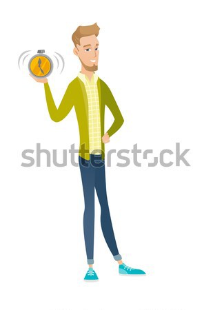 Young hindu builder holding alarm clock. Stock photo © RAStudio