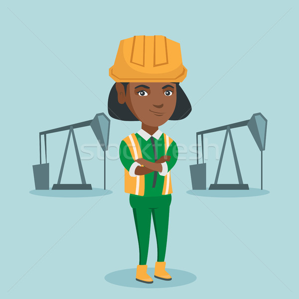 Cnfident oil worker standing with crossed arms. Stock photo © RAStudio