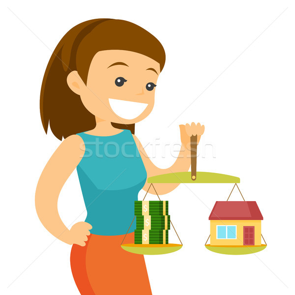 Young woman holding scales with money and house. Stock photo © RAStudio