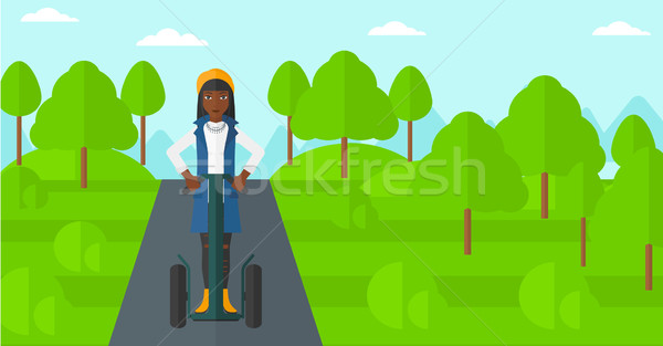 Woman riding on electric scooter. Stock photo © RAStudio