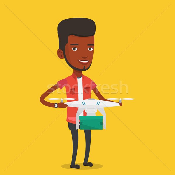 Man controlling delivery drone with post package Stock photo © RAStudio