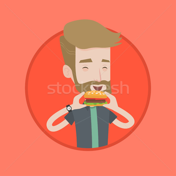 Uomo mangiare hamburger felice Foto d'archivio © RAStudio
