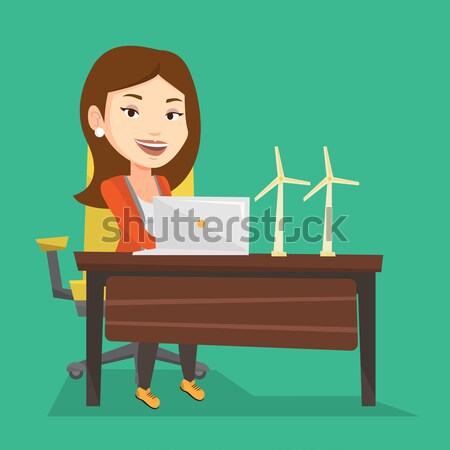 Woman working with model of wind turbines. Stock photo © RAStudio