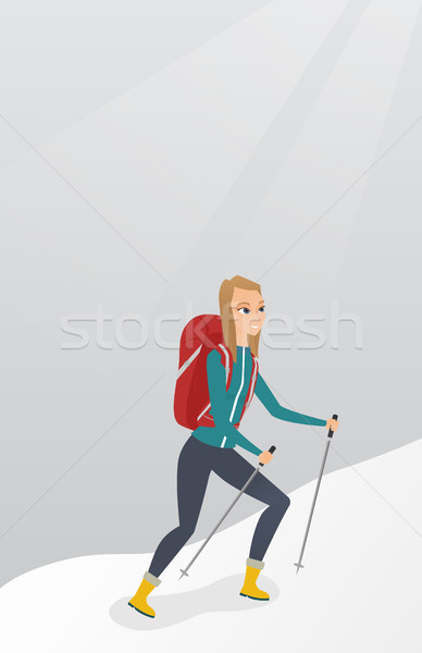 Caucasian mountaineer climbing a snowy ridge. Stock photo © RAStudio