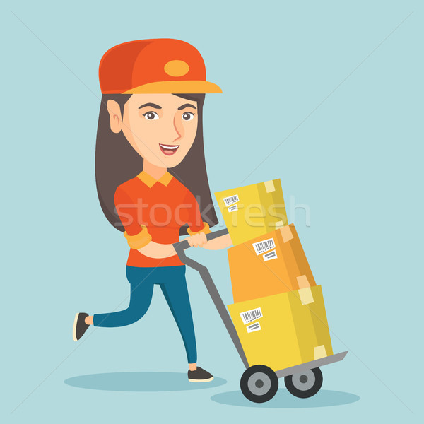 Woman-postman pushing the trolley with parcels. Stock photo © RAStudio