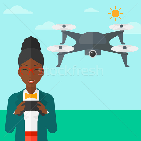 Woman flying drone. Stock photo © RAStudio